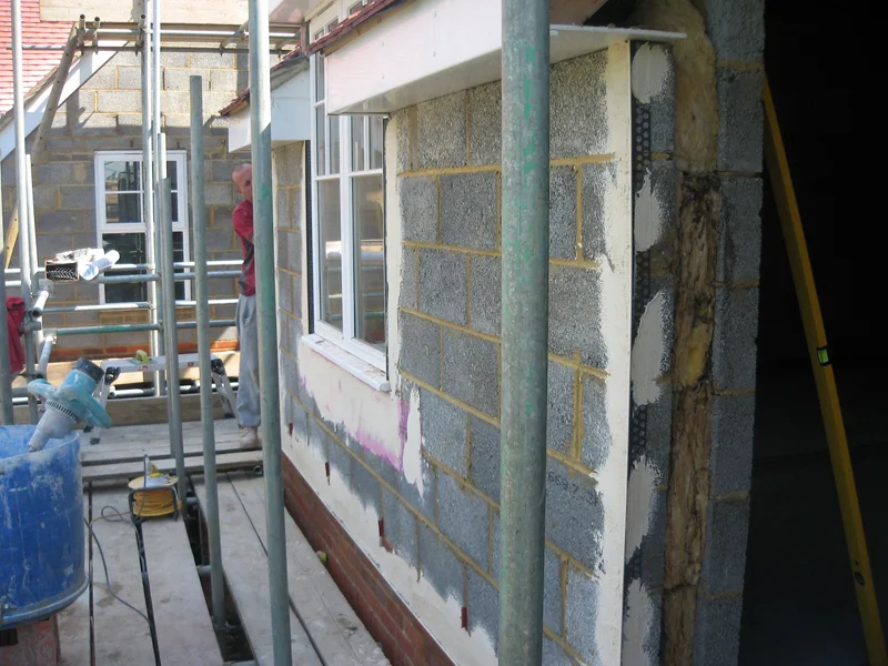 Blockwork and scaffold setup for new build rendering
