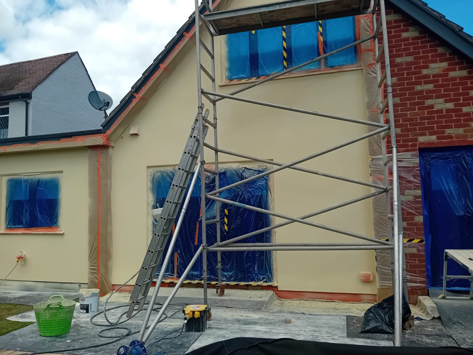 Cream coloured rendering finish on house front elevation