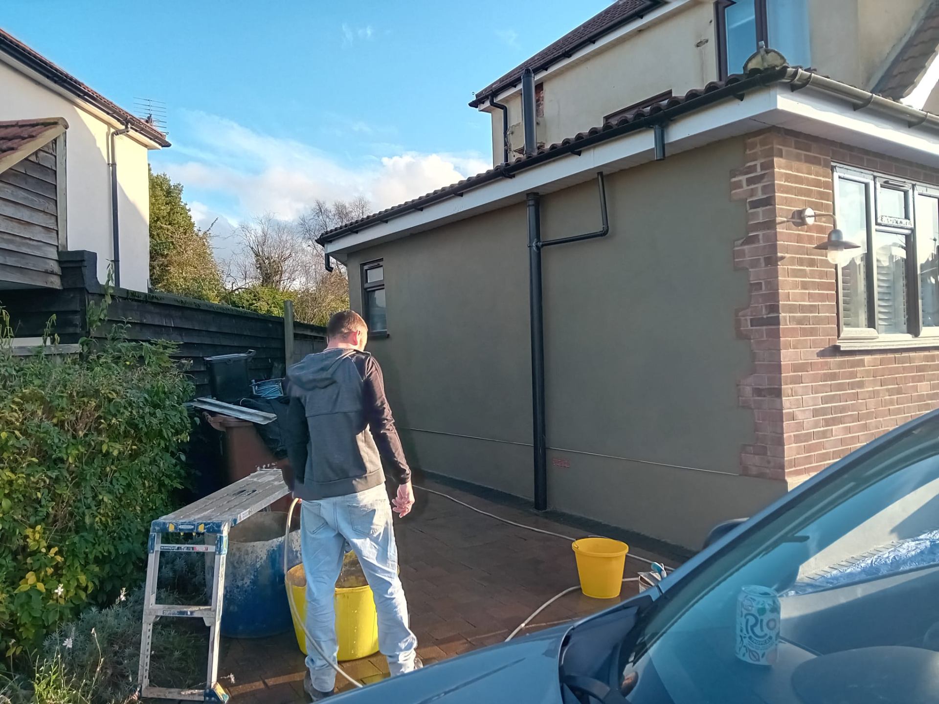 Experienced plastering contractor at work on exterior rendering project